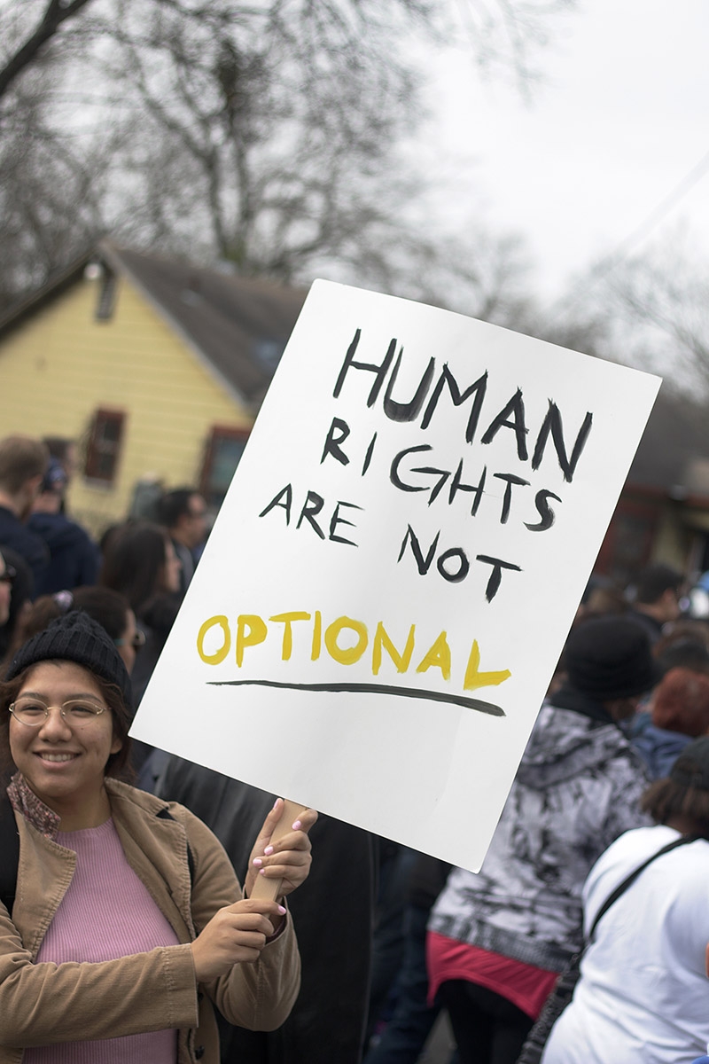 Aalysa Morales, 18, participates in the MLK March Monday on San Antonio's East Side. Photo by Noah Alcala Bach | Heron Contributor