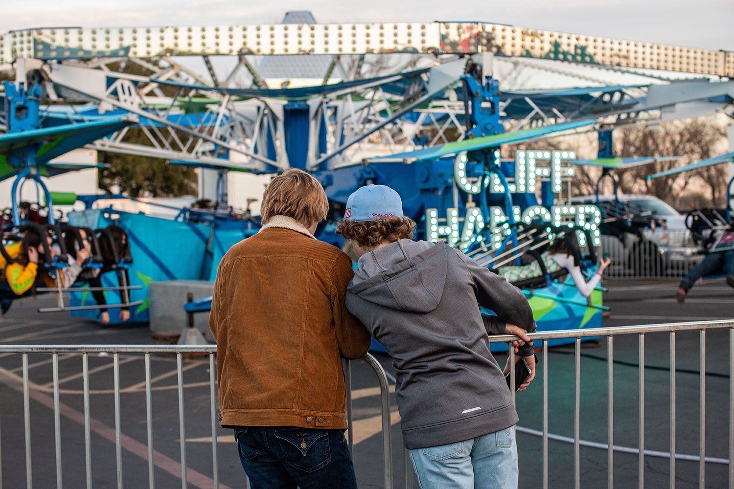 People enjoy a carnival ride at the San Antonio Stock Show and Rodeo carnival on Friday, Feb. 18, 2022. Photo by Kaylee Greenlee Beal | Heron contributor