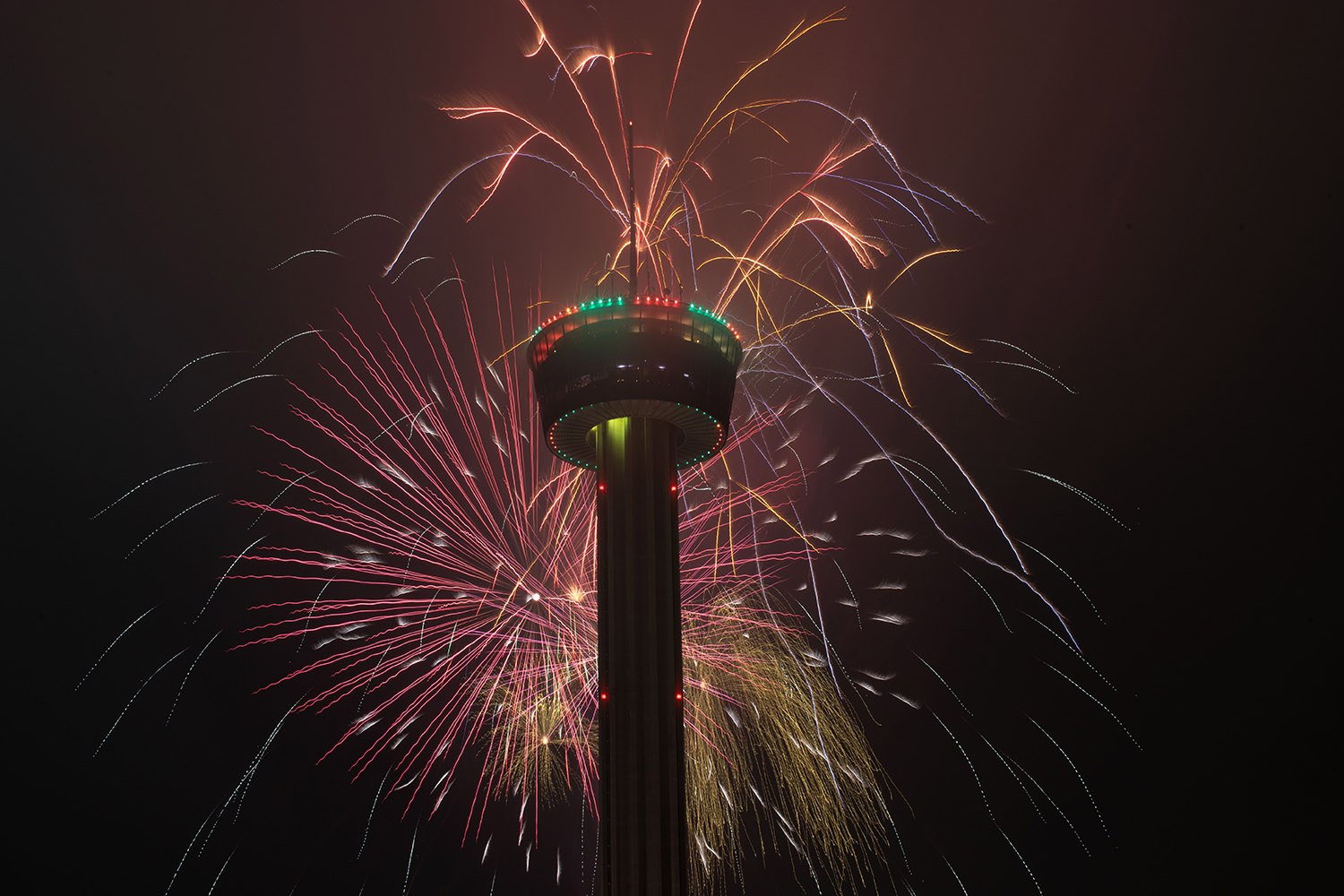 Dozens of fireworks exploded around the Tower of the America’s to ring in 2022 in San Antonio,Texas, on Jan. 1, 2022. (Kaylee Greenlee / San Antonio Heron)