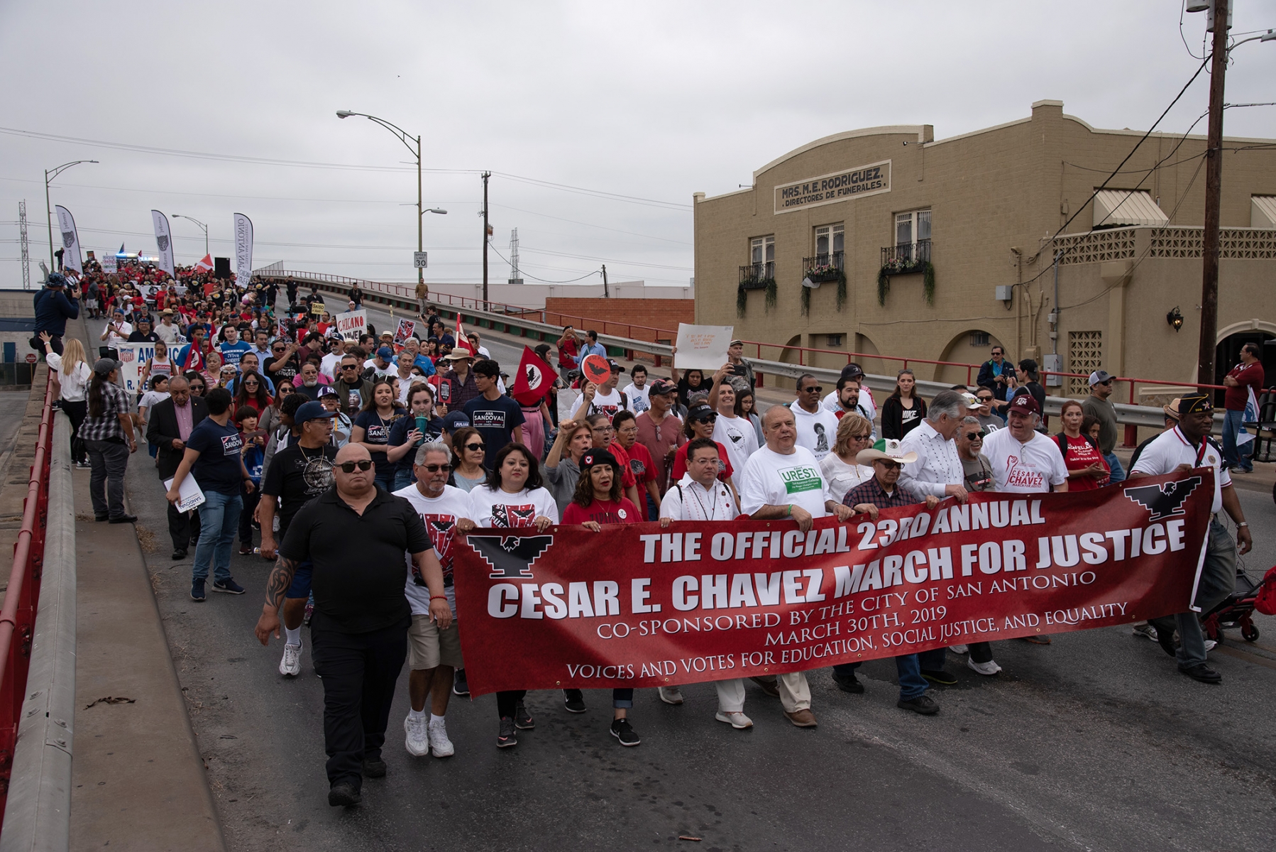 Participants walk down Guadalupe Street during San Antonio’s 23rd annual César E. Chávez March for Justice on Saturday, March 30. Photo by V. Finster | Heron