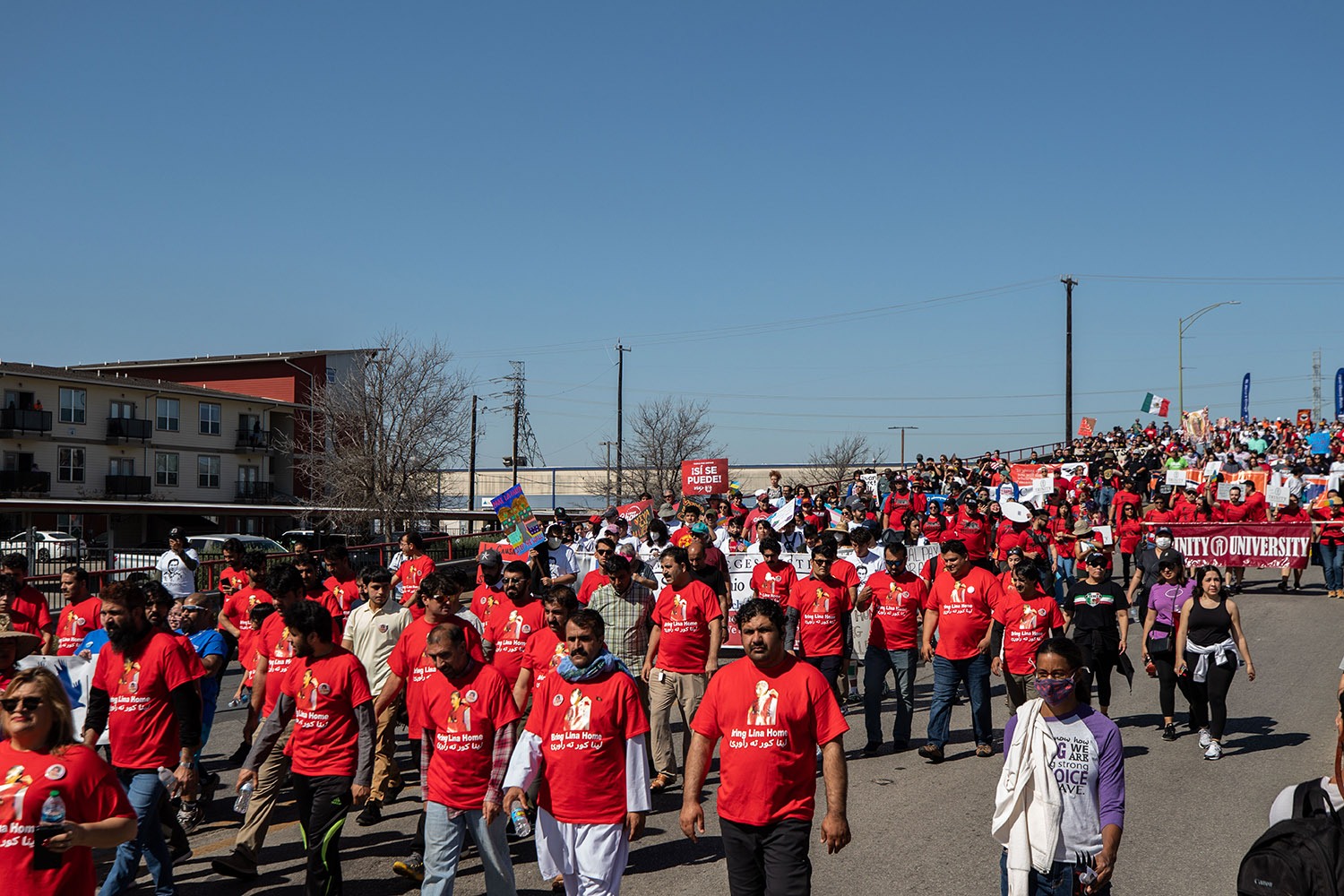 Thousands of people, including a couple dozen raising awareness about the disappearance of Lina Khil, march in the 26th annual Cesar E. Chavez March for Justice through downtown San Antonio, Texas, on Saturday, March 26, 2022. Photo by Kaylee Greenlee Beal | Heron contributor