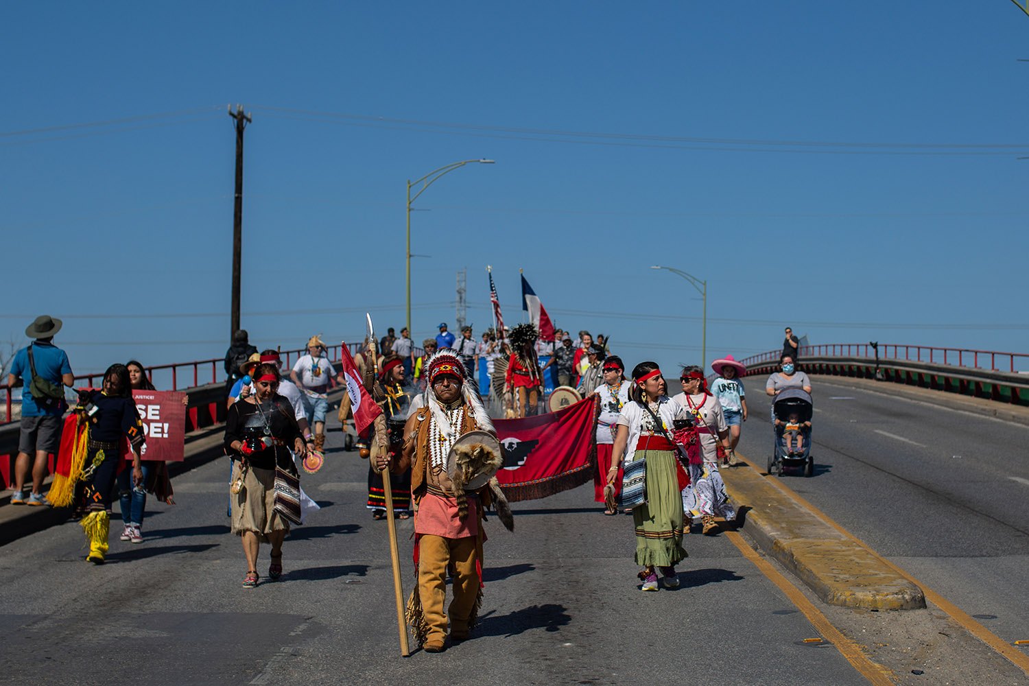 Moses Hernandez, principal chief of The Apache Council of Texas, leads thousands in the 26th annual Cesar E. Chavez March for Justice through downtown San Antonio, Texas, on Saturday, March 26, 2022. Photo by Kaylee Greenlee Beal | Heron contributor