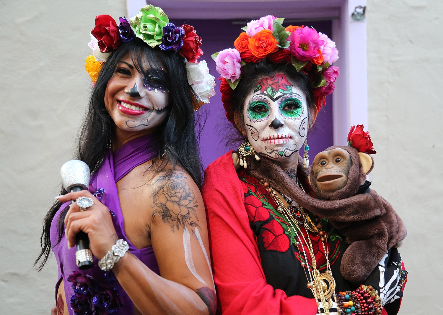 Ines Magana Picasso (left) and Estella Olivas attend the Dia de los Muertos festival Saturday at La Villita. <em><b>Photo by Ben Olivo | Heron</b></em>