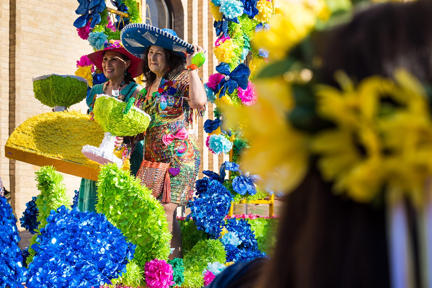 Cindy Ortega and Deborah Travieso take a photo-op with Fiesta props during Fiesta Fiesta at Hemisfair, San Antonio, TX, on Thursday, March 31, 2022. Photo by Chris Stokes | Heron contributor