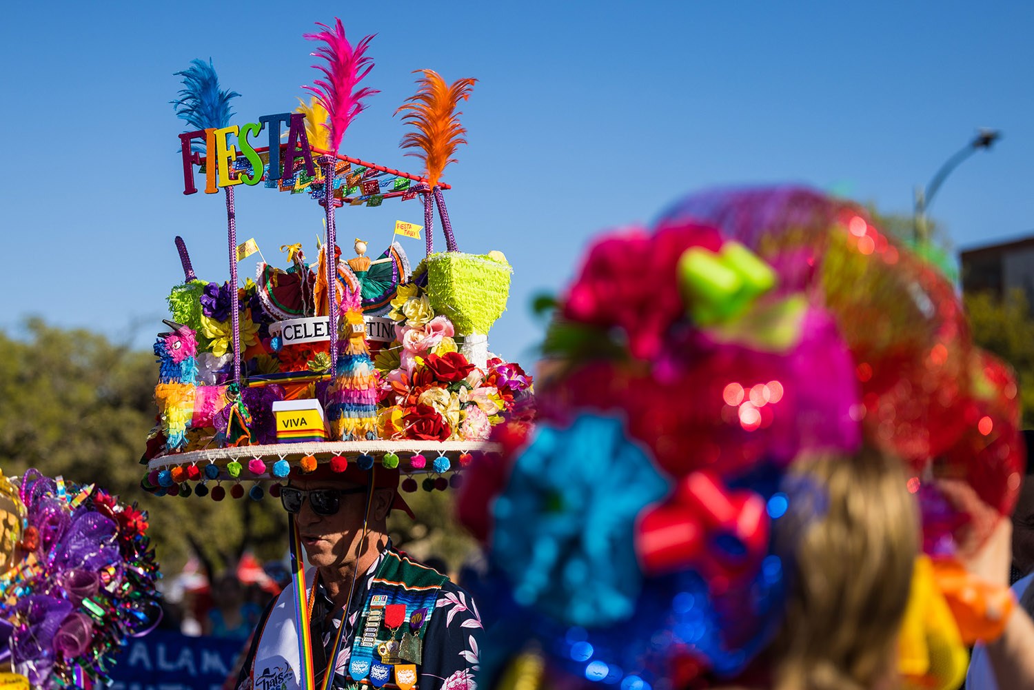 Tye Wychert wears his colorful fun Fiesta hat during Fiesta Fiesta at Hemisfair, San Antonio, TX, on Thursday, March 31, 2022. Photo by Chris Stokes | Heron contributor