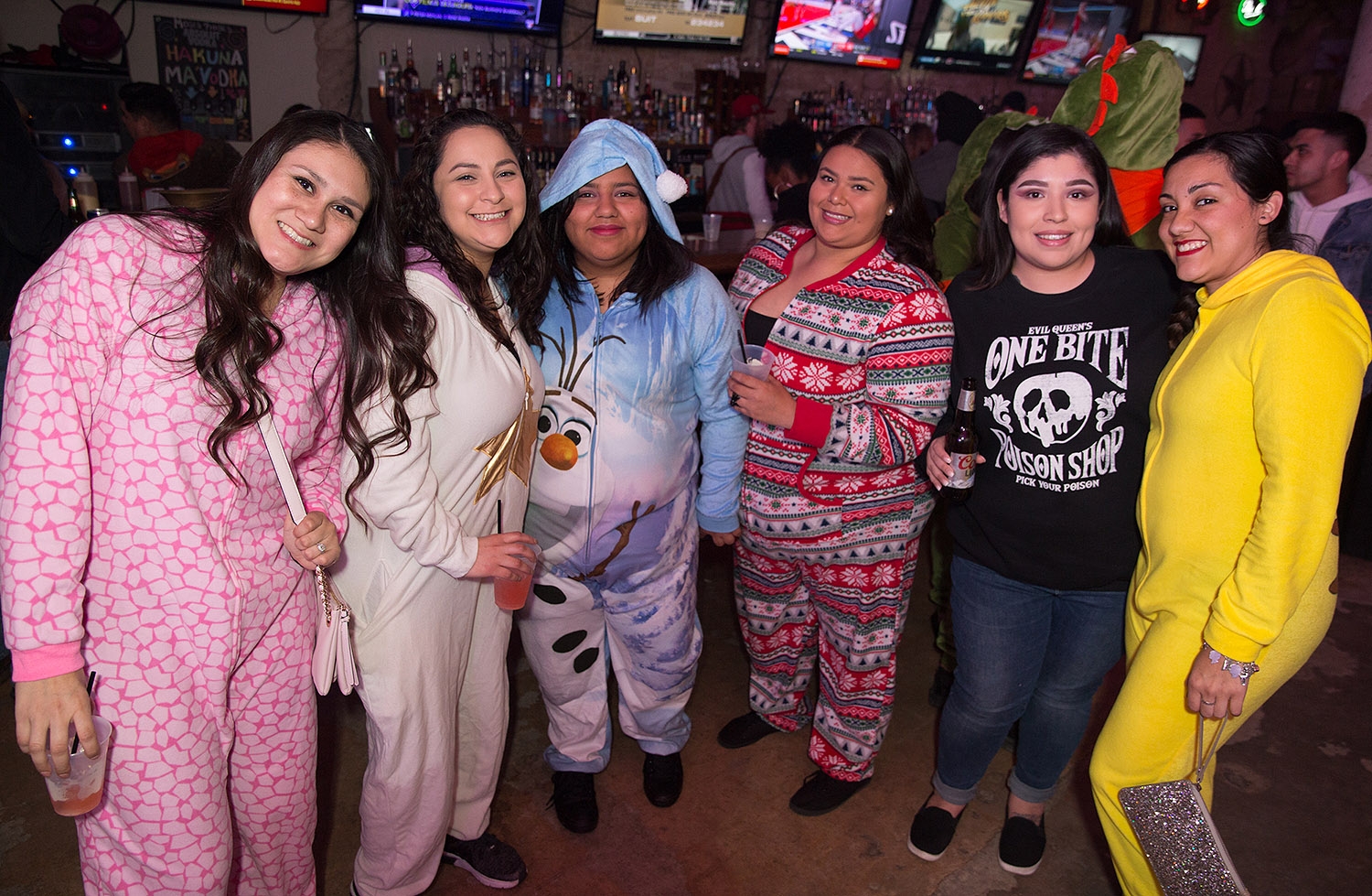Pub runners have some drinks and bust a few moves during the onesie-themed Pub Run at Moses Rose's Hideout, Jan. 4, 2019. <em><b>Photo by B. Kay Richter | Heron contributor</b></em>