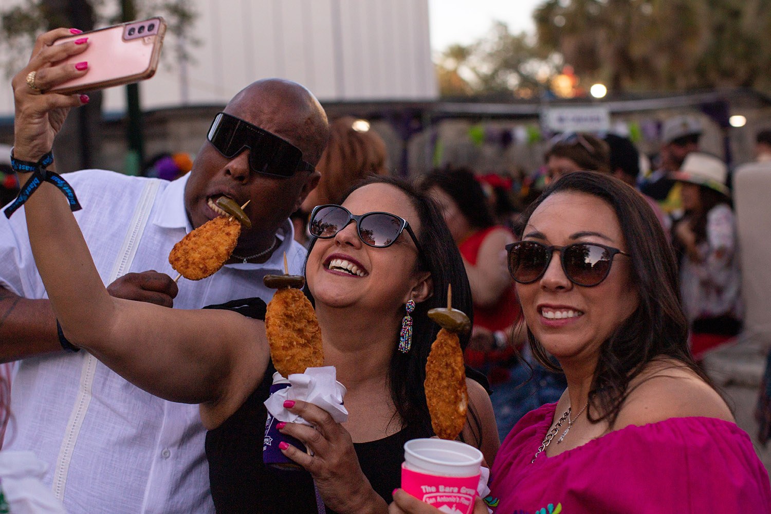 Chickens-on-a-stick are sold by the thousands at the Mr. Chicken booth on the second night of A Night in Old San Antonio, or NIOSA, during Fiesta on Wednesday, April 6, 2022, at La Villita in downtown San Antonio, Texas. Photo by Kaylee Greenlee Beal | Heron contributor