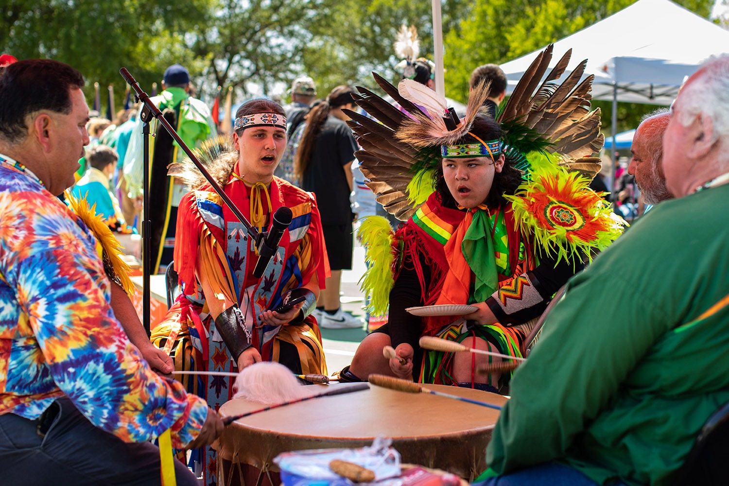 C.J. Hinojosa and Robby Soto sing, chant and pound the drums at a Native American Fiesta Pow Wow at Mission County Park #2, San Antonio, Texas. Photo by Kaylee Greenlee Beal | Heron contributor
