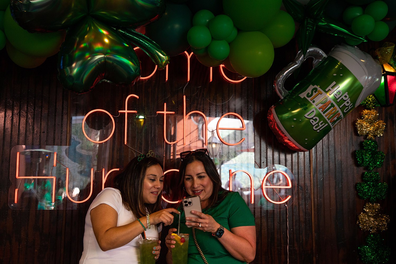 Christina Liserio and Emilia Gomez wait for a table to open up at Pat O’Brien’s in downtown San Antonio, Texas, on Thursday, March 17, 2022. Photo by Kaylee Greenlee Beal | @kgreenleephoto | Heron contributor
