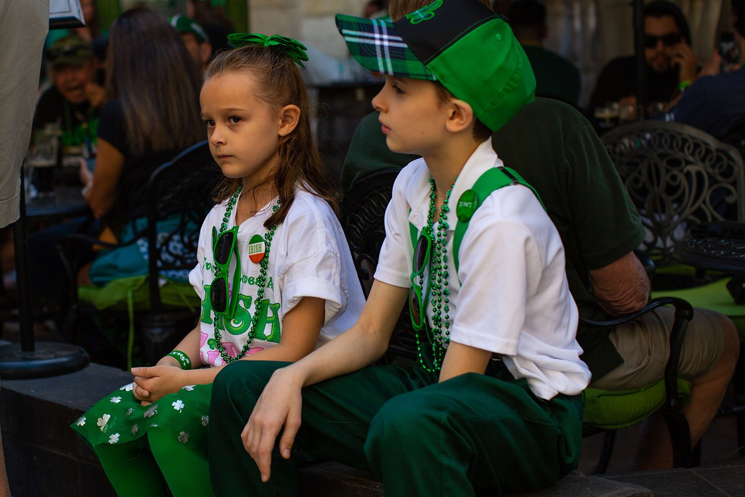 Caitlyn and Maurice sit outside Waxy O’Connor’s Irish Pub in downtown San Antonio, Texas, on Thursday, March 17, 2022. Photo by Kaylee Greenlee Beal | @kgreenleephoto | Heron contributor