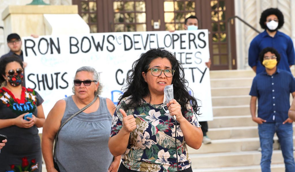 Jessica O. Guerrero, former chairwoman of the Housing Commission, airs her grievances at a protest in front of City Hall on July 14, 2021.