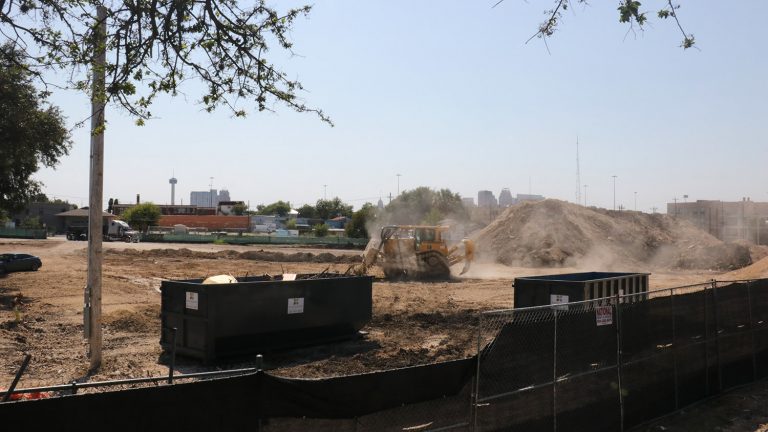 Construction work continues on Oct. 6 on Encore Multifamily's 386-unit apartment building that consumes most of the land bound by North Alamo, East Grayson, Austin, and West Carson streets.