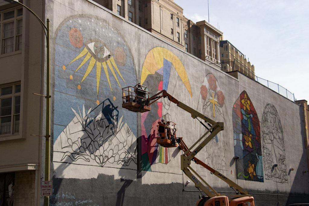 This past May, the Travis Park Church, launched a 3,500 square foot mural project called “All are Welcome, Love Conquers Hate.