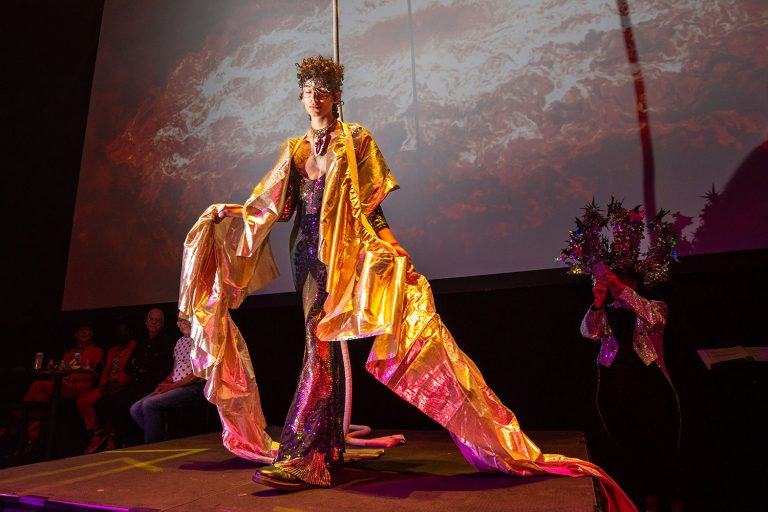 Alejo Peña Soto models one of Agosto Cuellar’s designs during a fashion show at the WEBB Party on Friday night, April 1, 2022, at the Aztec Theater in downtown San Antonio, Texas. Photo by Kaylee Greenlee Beal | Heron contributor